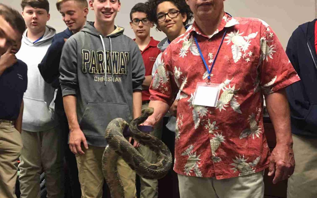 Mr. Woodson holding a snake