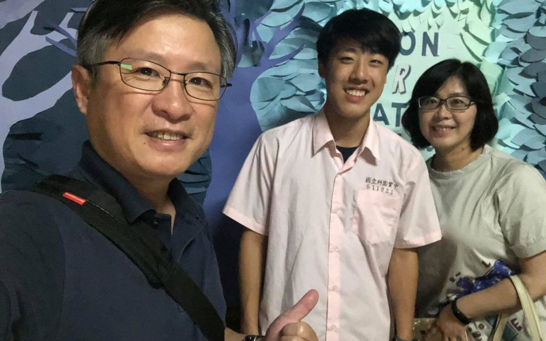 Ricky Lee with parents, high school graduation